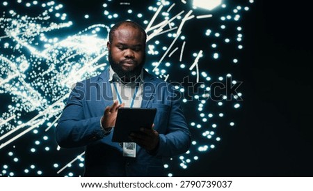 Computer scientist optimizes neural network neurons map with tablet and AR simulation tech, african american man fine tuning machine learning AI model synaptic weights with device, camera B.