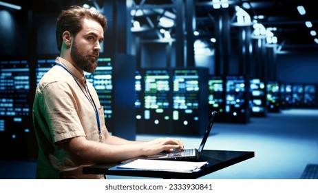 Computer scientist running server clusters diagnostic tests and error checking utilities to determine and mend software problems. Mechanic investigating critical systems, checking for faults