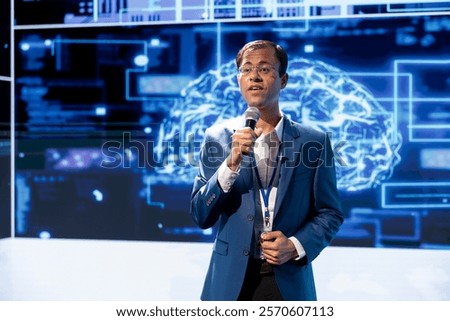 Computer scientist speaking at tech event, explaining impact of artificial intelligence technology. Data analyst presenting risks and threats associated with AI during discussion panel