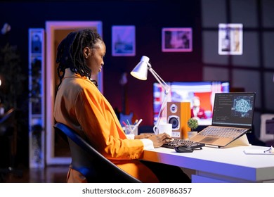 Computer scientist updating artificial intelligence neural networks, writing binary code scripts. Remote worker in apartment office uses digital device programming to upgrade AI