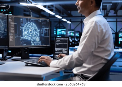 Computer scientist using AI tech on computer to do checkup in server room providing storage. IT professional in data center using PC to enable artificial intelligence to process datasets for training