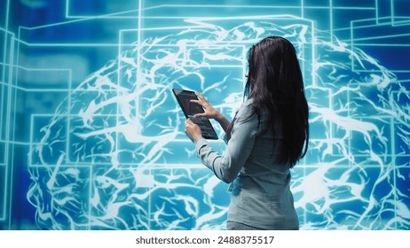 Computer scientist using artificial intelligence computing simulating human brain thought processes. Indian employee working on tablet, developing AI machine learning algorithms, camera B