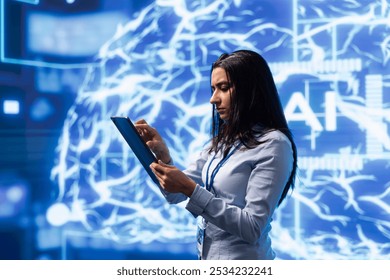 Computer scientist using artificial intelligence computing simulating human brain thought processes. Indian employee working on tablet, developing AI machine learning algorithms
