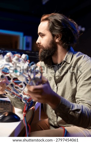 Computer scientist using EEG headset to upload his mind into computer, attaining immortality; software developer in apartment experimenting with transferring consciousness into cyberspace.
