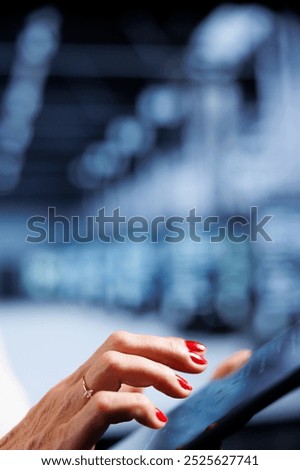 Computer scientist using tablet, ensuring valuable data remains shielded from potential risks, safeguarding server mainframes against unauthorized access and vulnerabilities, close up