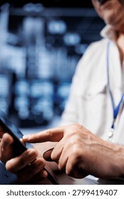Computer scientist using tablet in high-tech workspace, installing dedicated VPN servers able to provide encrypted sensitive data, online anonymity and fast speed bandwidth to clients, close-up.