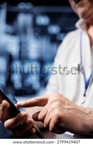Computer scientist using tablet in high-tech workspace, installing dedicated VPN servers able to provide encrypted sensitive data, online anonymity and fast speed bandwidth to clients, close-up.