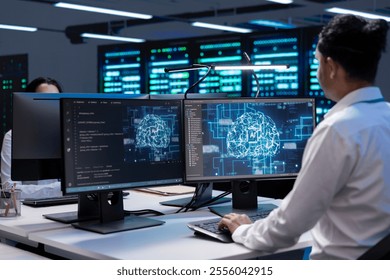 Computer scientist working in data center providing computing resources needed for artificial intelligence to process massive datasets. Man in server farm storing data used for machine learning
