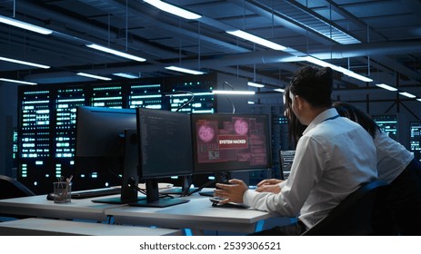 Computer scientists in server room protect hardware from hacker attack stealing sensitive information. Data center cybersecurity division teamworking colleagues fighting security breach, camera B