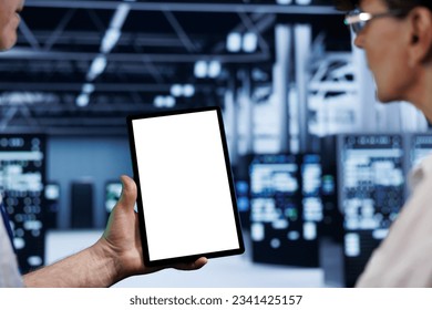 Computer scientists using mock up tablet to check blade servers, close up. Machines in computer network security data storage business providing processing and memory resources for several workloads