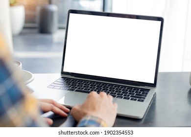 computer screen blank mockup.hand woman work using laptop with white background for advertising,contact business search information on desk at coffee shop.marketing and creative design
 - Powered by Shutterstock