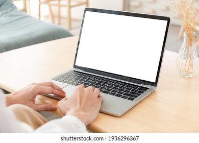 computer screen blank mockup.hand woman work using laptop with white background for advertising,contact business search information on desk at coffee shop.marketing and creative design