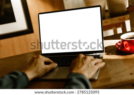 computer screen blank mockup.work using laptop with white background for advertising,contact business search information on desk at coffee shop.marketing and creative design