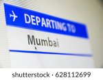 Computer screen close-up of status of flight departing to Mumbai, India