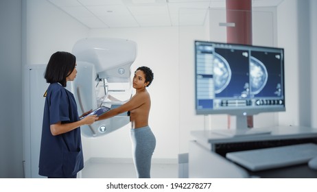 Computer Screen in Hospital Radiology Room: Beautiful Multiethnic Young Woman Standing Topless Undergoing Mammography Screening Procedure. Screen Showing the Mammogram Scans of Dense Breast Tissues.