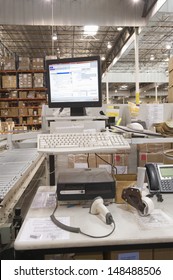 Computer Screen And Keyboard In Distribution Warehouse