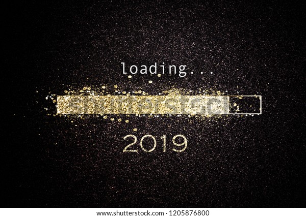 Computer screen with loading bar counting down for New Years Eve 2019 with sparkling glitter and copy space over black