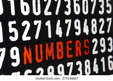 Computer screen with numbers text on black background. Horizontal