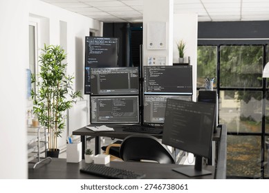 Computer screens display compiling HTML code and data parsing algorithms in empty startup office, suggesting active security systems and backend processes running without staff present.