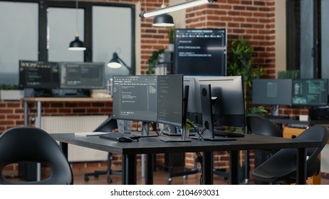 Computer Screens Running Programming Code In Empty Software Developing Agency Office And Computers Parsing Data Algorithms In Background. Neural Network Servers Cloud Computing In Data Room.