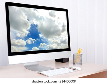 Computer with screensaver on table