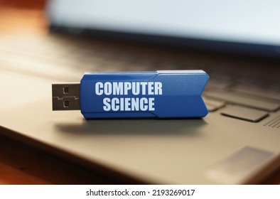 Computer And Security Concept. On The Laptop Keyboard Is A Flash Drive With The Inscription - Computer Science