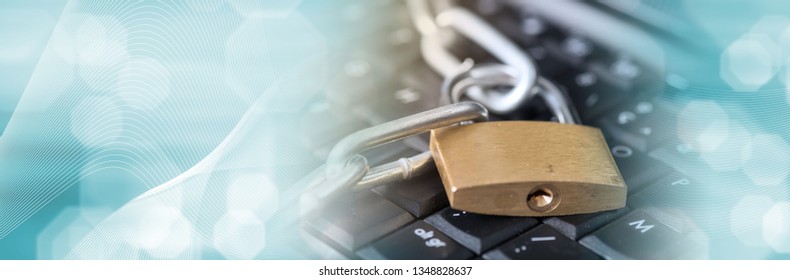 Computer Security Concept With A Padlock And A Chain On A Keyboard, Light Effect. Panoramic Banner