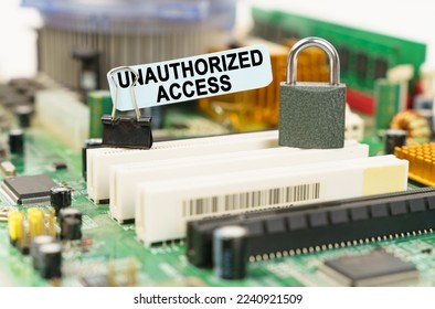 Computer security concept. There is a sticker on the motherboard that says - Unauthorized Access - Shutterstock ID 2240921509
