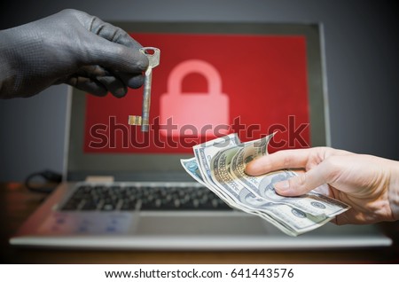 Computer security and extortion concept. Ransomware virus has encrypted data in laptop. Hacker is offering key to unlock encrypted data for money.