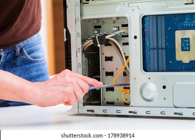 Computer Specialist Use Screwdriver To Repair Hardware