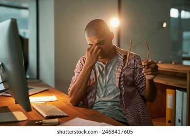 Computer, stress and man with headache in office for pressure, fatigue and deadline of article. Journalist, editor and person and pain at creative agency for digital report, brain fog and burnout - Powered by Shutterstock