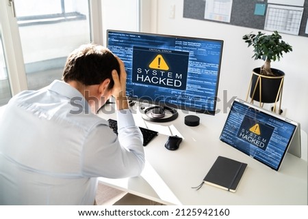 Computer System Hacked. Virus Software Screen On Monitor