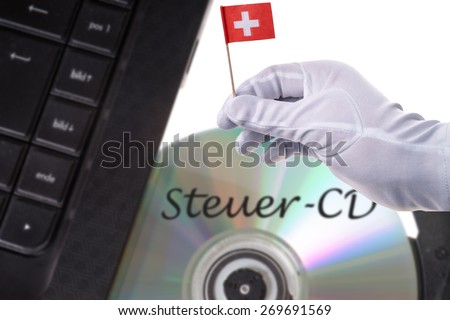 Computer with Tax evaders CD and Swiss flag / Tax evaders CD