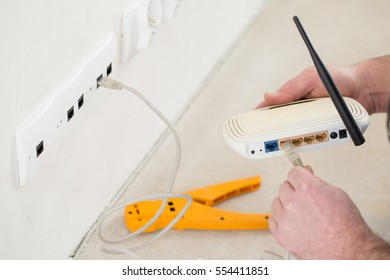 Computer technician connects the Internet
 - Powered by Shutterstock