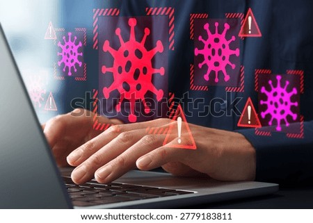 Computer virus infection and security software identifying malware. Businessman using laptop computer infected with ransomware.