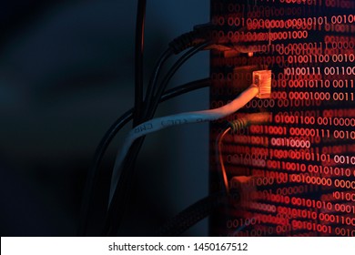 computer virus transfer into desktop pc by internet LAN line. double exposure shot of backside of a computer and red binary codes. hacker virus spyware ransomware and security breached concepts.