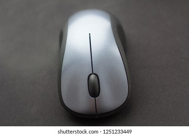 Computer Wireless Mouse Close Up On A Black Mousepad