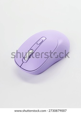 computer wireless mouse in a modern design, purple on a light background