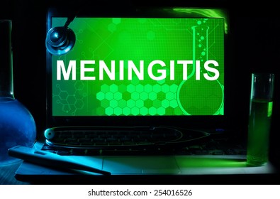 Computer with words  Meningitis. Test tubes, stethoscope and thermometer. 