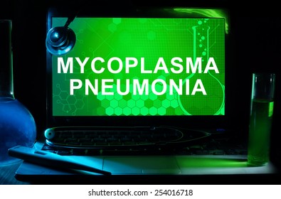 Computer With Words Mycoplasma Pneumonia. Test Tubes, Stethoscope And Thermometer. 