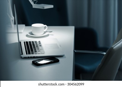 Computer Work At Night. Laptop Computer Desk Lamp And Coffee Cup. 