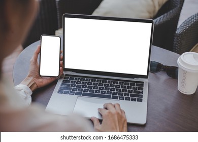 Computer,cell Phone Mockup Image Blank Screen With White Background For Advertising Text,hand Woman Using Laptop Texting Mobile Contact Business Search Information On Desk In Cafe.marketing,design