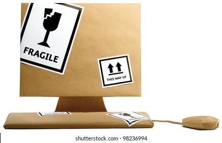 computer,keyboard and mouse wrapped in brown paper isolated on a white background ready to move office - Powered by Shutterstock