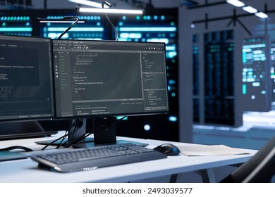 Computers in data center facility used for managing rackmounts energy consumption. PCs in high tech establishment used for automation and monitoring processes in server room, close up