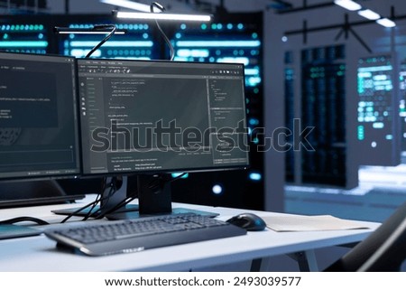 Computers in data center facility used for managing rackmounts energy consumption. PCs in high tech establishment used for automation and monitoring processes in server room, close up