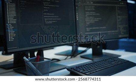 Computers in data center facility used for managing rackmounts energy consumption. PCs in high tech establishment used for automation and monitoring processes in server room, close up