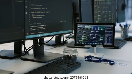 Computers and tablet in server room used for developing disaster recovery plans ensuring minimal downtime. Data center electronic equipment used for monitoring performance