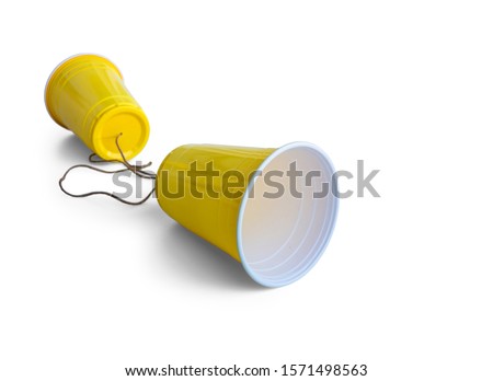 Comunication Yellow Plastic cup with string isolated on white