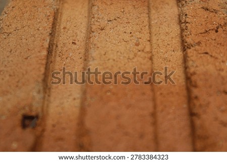 concave texture of two bars in red brick.