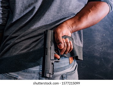 Conceal Carry Concept African American Male With Handgun Behind Back